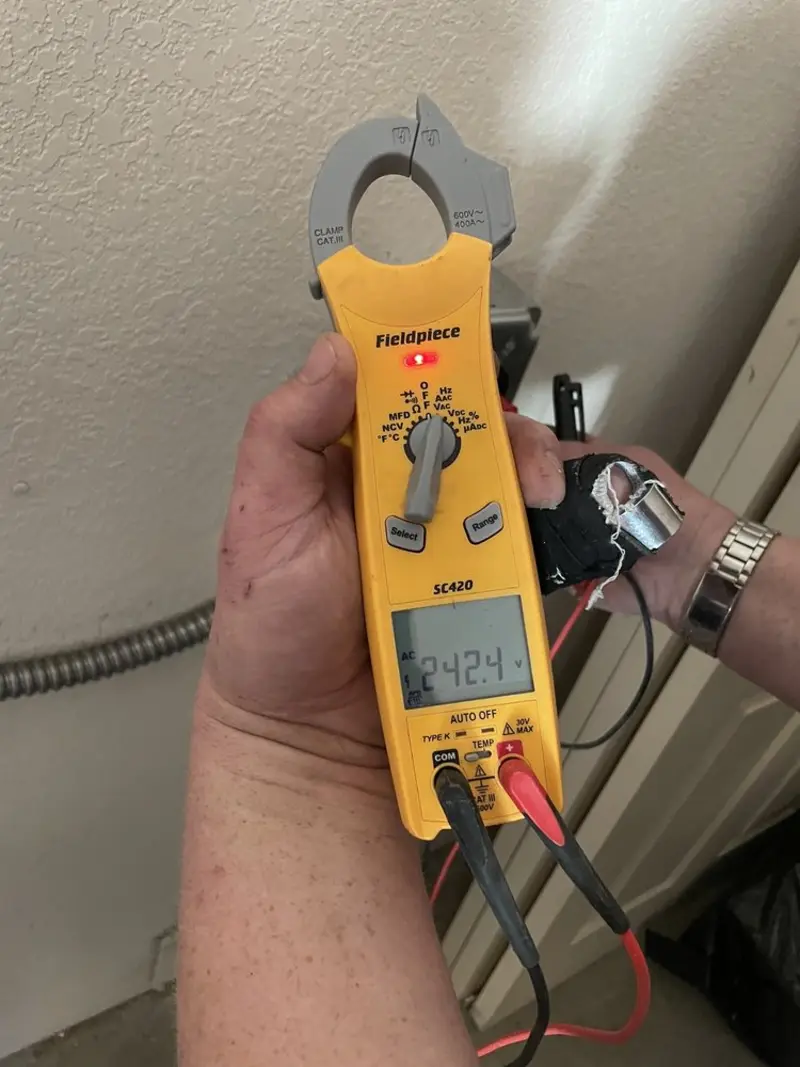 Voltage testing with clamp meter during Circuit Breaker Repair in Olathe